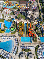 Top-down aerial view of a colorful water park in Nessebar, Bulgaria, with pools and slides. Vibrant summer resort scene showing leisure, recreation and tourism from a drone perspective