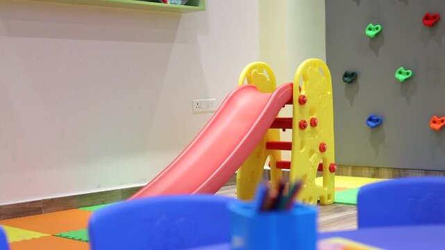 Colourful children's slide inside a playroom