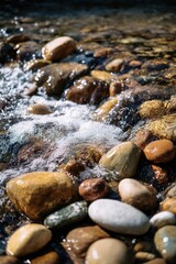 Colorful smooth pebbles along a rocky shoreline with foamy water washing over them. Concept Colorful pebbles, Rocky shoreline, Foamy waves, Coastal textures, Seascape photography