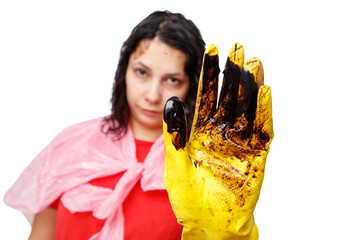 A woman wearing a red shirt and a yellow glove. She is holding her hand up in a "stop" gesture.