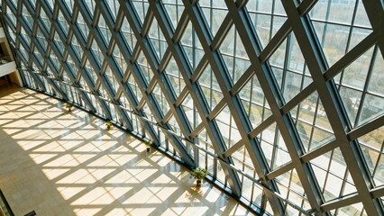 Triangular lattice roof casting long interior patterns
