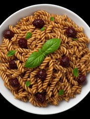Fusilli pasta with olives and basil