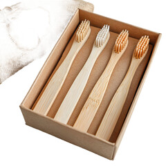 Flat lay of eco-friendly bathroom accessories including bamboo toothbrushes