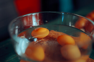 Eggs Placed in a Bowl of Water to Check for Rottenness. Like hacking test for uncooked eggs to see if they are expired 
