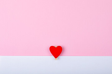 Directly above shot of heart shape on pink and white background, copy space