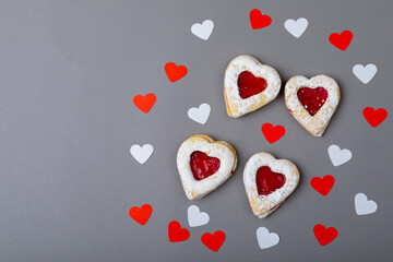 Overhead view of heart shaped dessert and decoration isolated on gray background, copy space