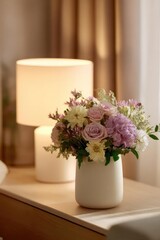 Fototapeta premium Pastel flower bouquet in a white vase on a wooden table, with a warm lamp in the background. Concept Pastel bouquet, White vase, Wooden table, Warm lighting, Still life