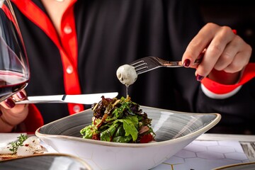 Woman Eating Salad With Cheese In Ukrainian Restaurant