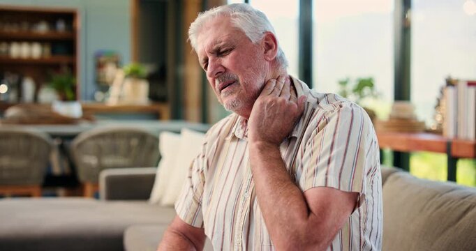 Senior man, neck pain and sofa with stress for muscle tension, strain or pressure in home. Elderly, male person or sore ache with injury or spasm for joint inflammation, arthritis or fatigue in house