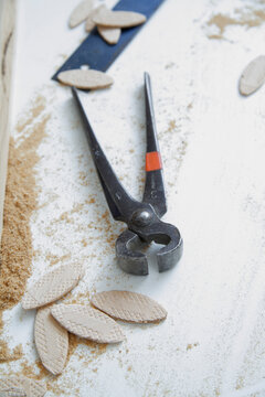 Pliers and wood biscuits on workbench in carpentry Schaeftlarn Upper Bavaria