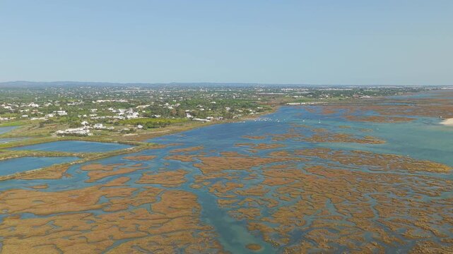 Aerial drone view of Fuseta backwaters and Ria Formosa lagoon Algarve
