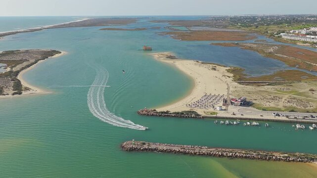 Aerial View of Fuseta Beach and Ria Formosa Inlet with Boat Wake