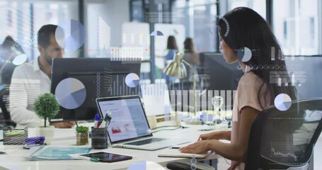 In office, business professionals analyzing data with animation graphics on desks - Powered by Adobe