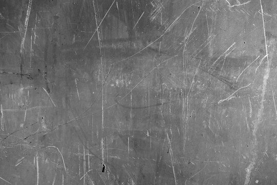 Rusted scratched grungy metal sheet texture.