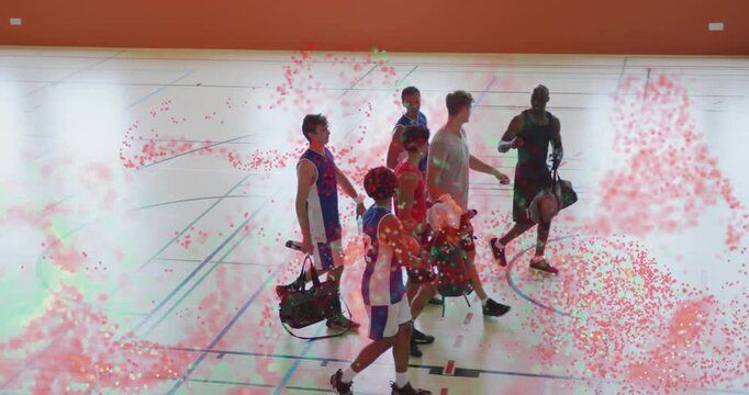 Basketball team entering gym carrying duffel bags and exchanging high-five to build team unity - Powered by Adobe