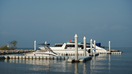 Yachts on the marina. Boat parked in the docks. Yachts in the port. 
