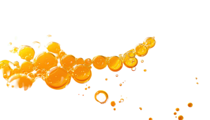 Glowing, orange spheres burst forward, isolated against a dark backdrop