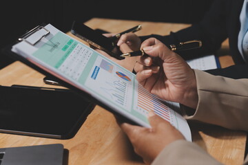 Accounting company provide finance and taxation planning for profitable cash flow, Auditor and accountant team working in office, analyze financial data and accounting record with calculator.Insight