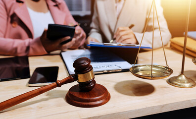 Consultation and conference of professional businesswoman and Male lawyers working and discussion having at law firm in office. Concepts of law, Judge gavel with scales of justice