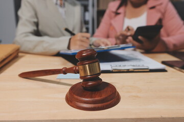 Consultation and conference of professional businesswoman and Male lawyers working and discussion having at law firm in office. Concepts of law, Judge gavel with scales of justice