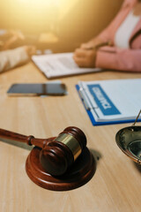 Consultation and conference of professional businesswoman and Male lawyers working and discussion having at law firm in office. Concepts of law, Judge gavel with scales of justice