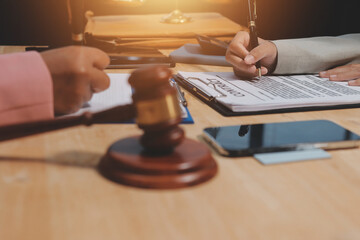 Consultation and conference of professional businesswoman and Male lawyers working and discussion having at law firm in office. Concepts of law, Judge gavel with scales of justice