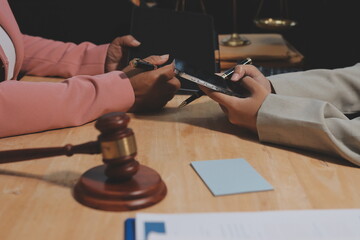 Consultation and conference of professional businesswoman and Male lawyers working and discussion having at law firm in office. Concepts of law, Judge gavel with scales of justice