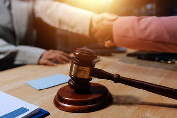 Consultation and conference of professional businesswoman and Male lawyers working and discussion having at law firm in office. Concepts of law, Judge gavel with scales of justice