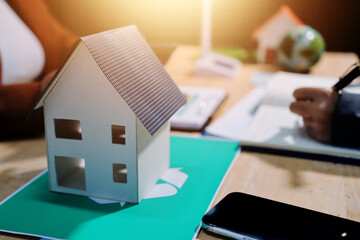 Asian woman lead young group of multiethnic businesspeople in team meeting, using laptop computer for ESG topic presentation on monitor. Sustainable business practice, people work at home concept