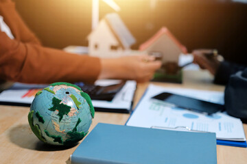 Asian woman lead young group of multiethnic businesspeople in team meeting, using laptop computer for ESG topic presentation on monitor. Sustainable business practice, people work at home concept