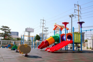 Slider and toy on children playground in public park.