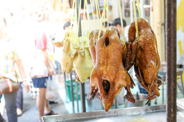 Dried stewed duck hanging with rope for sale in the market