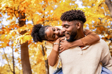  Couple Sharing Loving Autumn Piggyback Moment