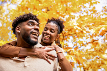  Couple Sharing Loving Autumn Piggyback Moment