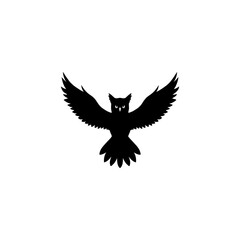 Obraz premium Black silhouette of a powerful owl flying with wide-spread wings, isolated on a white background