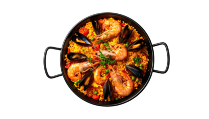 Overhead shot of seafood paella in a pan on a black backdrop