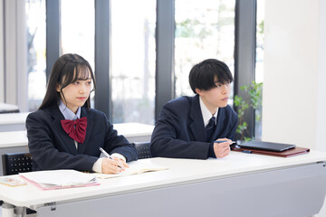 High school students taking notes in classrooms at schools, cram schools, and prep schools, actively engaged in lessons Images of university entrance exams and similar situations