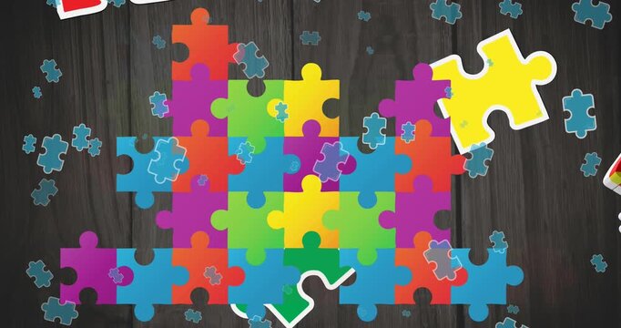 Animations of colorful puzzle pieces over black wooden background