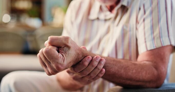 Senior man, hands and wrist pain with injury for carpal tunnel syndrome or arthritis in home. Closeup, elderly or male person with sore arm for joint inflammation, muscle tension or strain in house