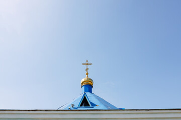Orthodox Church Dome with Golden Cross and Blue Roof