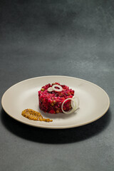 Classic Russian Beet Salad with Mustard Seeds on Plate. Vinaigrette