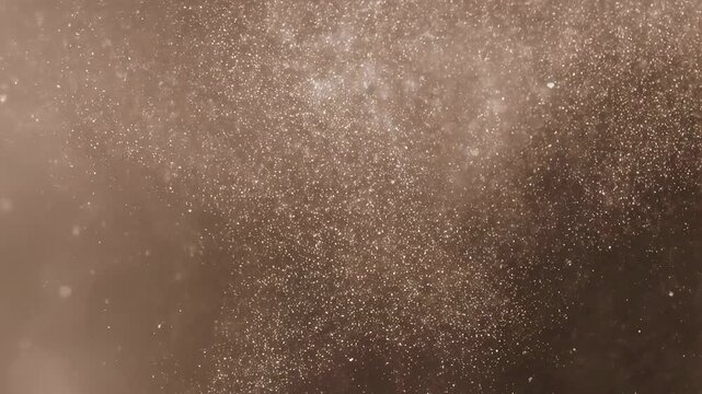 Shimmering golden particles floating in the air, creating a magical and enchanting atmosphere. Ideal for festive celebrations and artistic projects