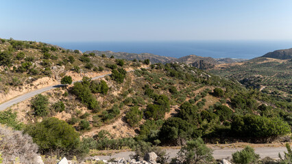 Explore the stunning landscape views of Crete Greece with winding roads and olive groves