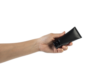Black cosmetic product or sunscreen cosmetic with hand on transparent background.