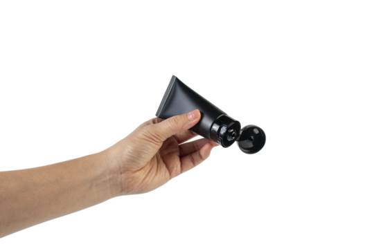 Black cosmetic product or sunscreen cosmetic with hand on transparent background. - Powered by Adobe