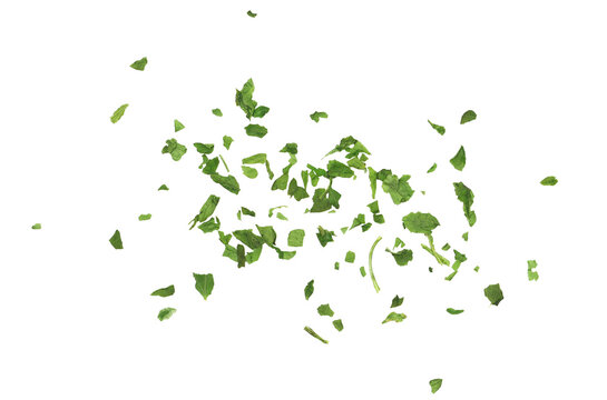 Chopped dry parsley leaves, pile isolated on white background, top view