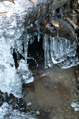 Frozen mountain stream in winter
