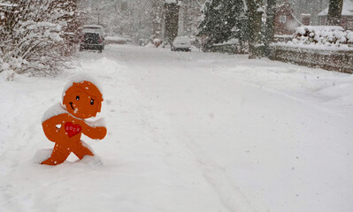 Snowfall in the city - Children playing in the snow road sign