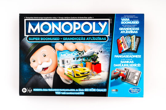 Valmiera, Latvia - December 09, 2025: Monopoly board game box featuring classic design, colorful graphics, and iconic character for family fun and entertainment