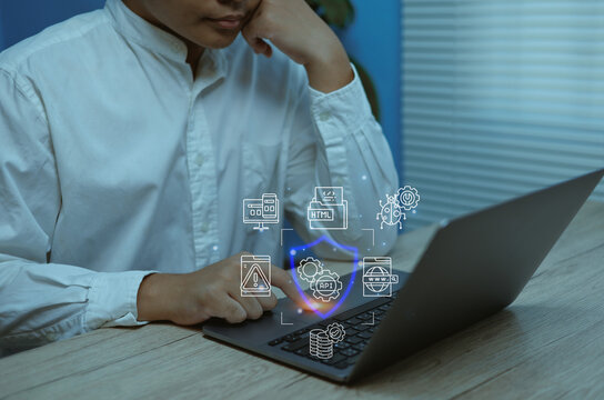 Business professional using laptop with cybersecurity icons, API and HTML symbols, representing secure web development, data protection, cloud security, and IT solutions for digital business growth - Powered by Adobe